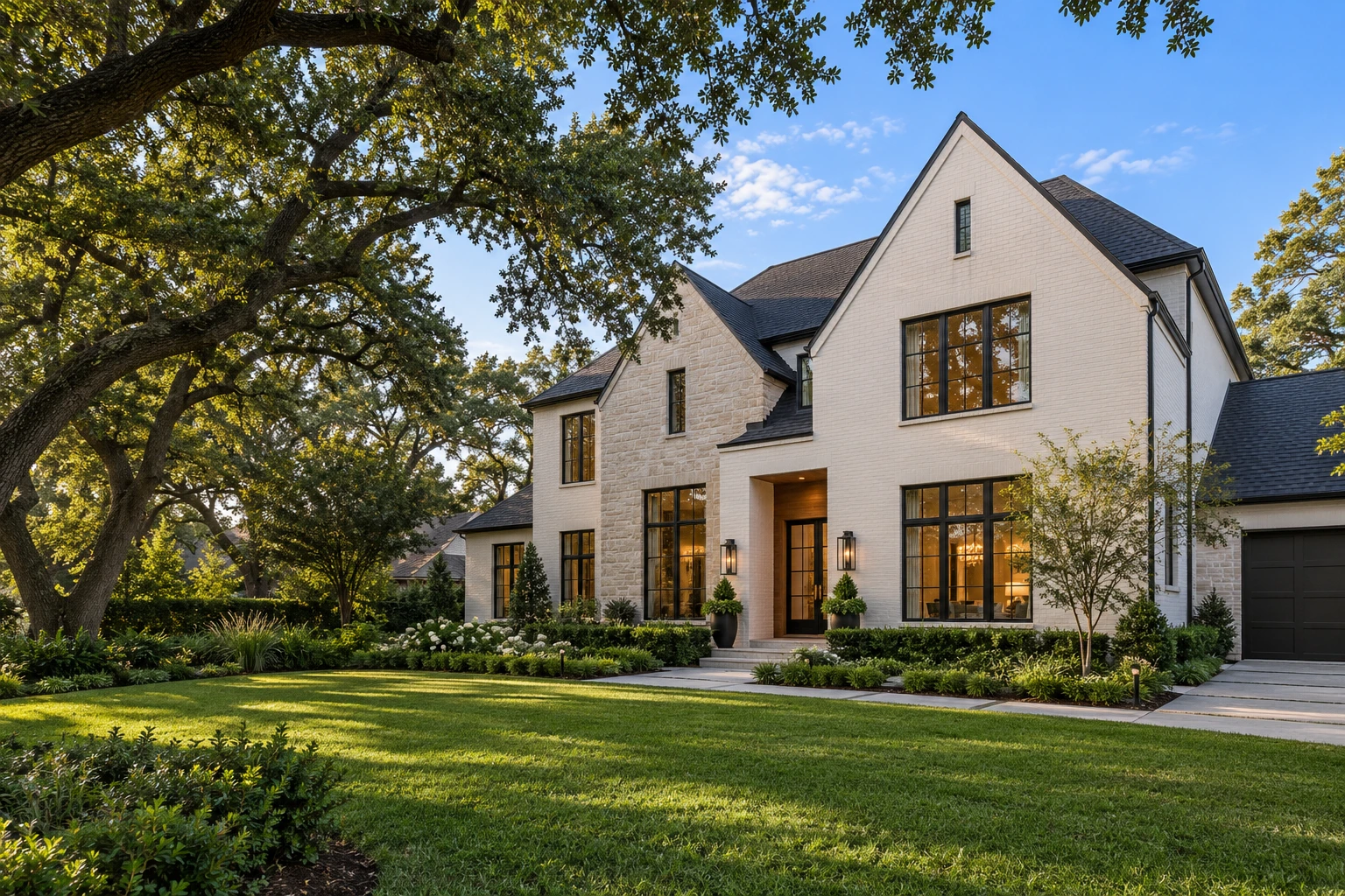 Illustrative Houston home with white brick, a charcoal roof and landscaped grounds
